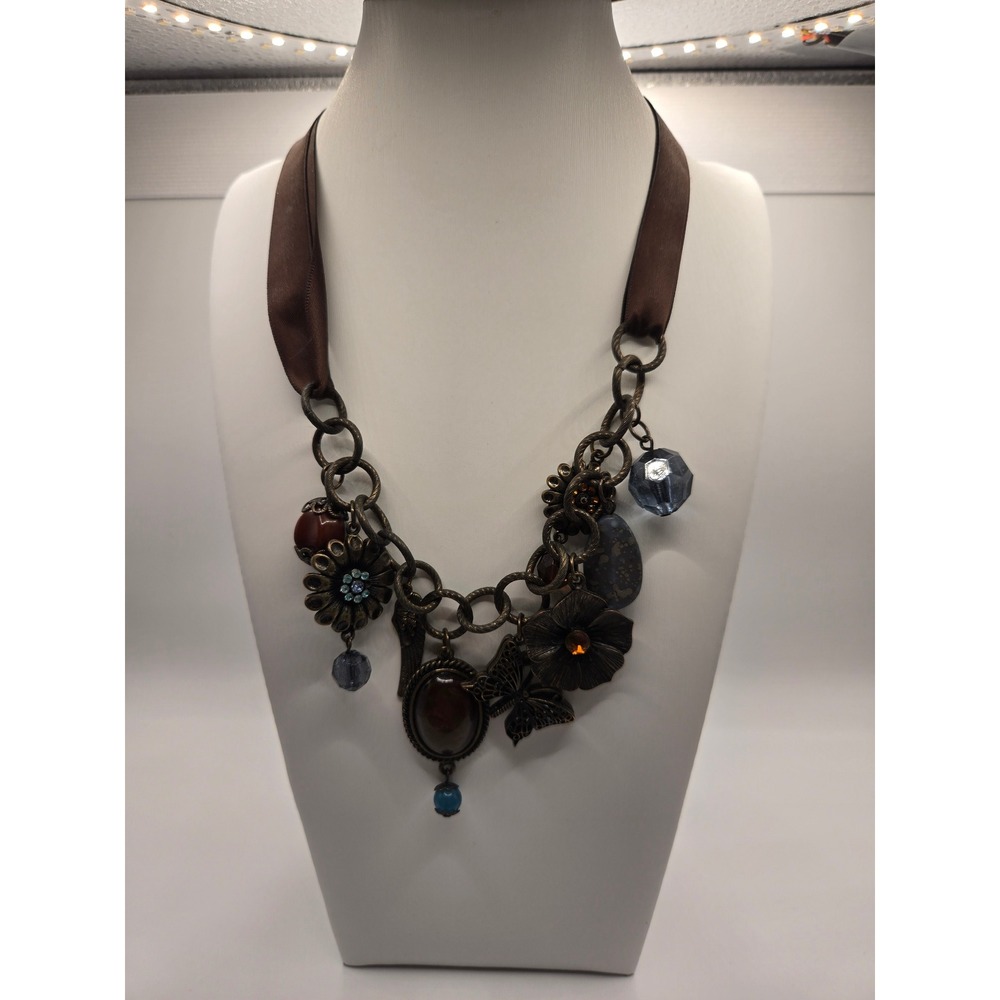 Icing Bronze Tone Mixed Media Charm Necklace Brown Ribbon Butterfly Flower Wing